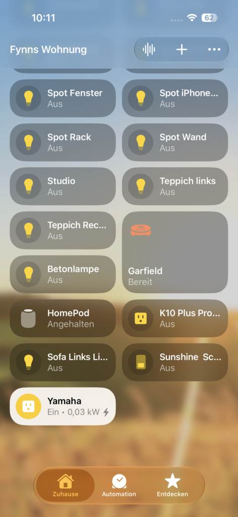 In Apples Home App zeigt iOS 27 bei einem Yamaha-Gerät den aktuellen Verbrauch von 0,03 kW direkt auf der Kachel und in den Details an, ohne App-Wechsel.