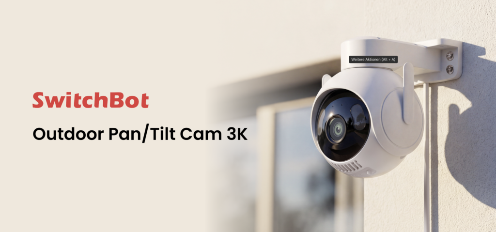 An der Hauswand montiert zeigt die weiße SwitchBot Outdoor Pan/Tilt Cam 3K mit 3K-Auflösung und 360°-Rundumblick auf den Außenbereich.